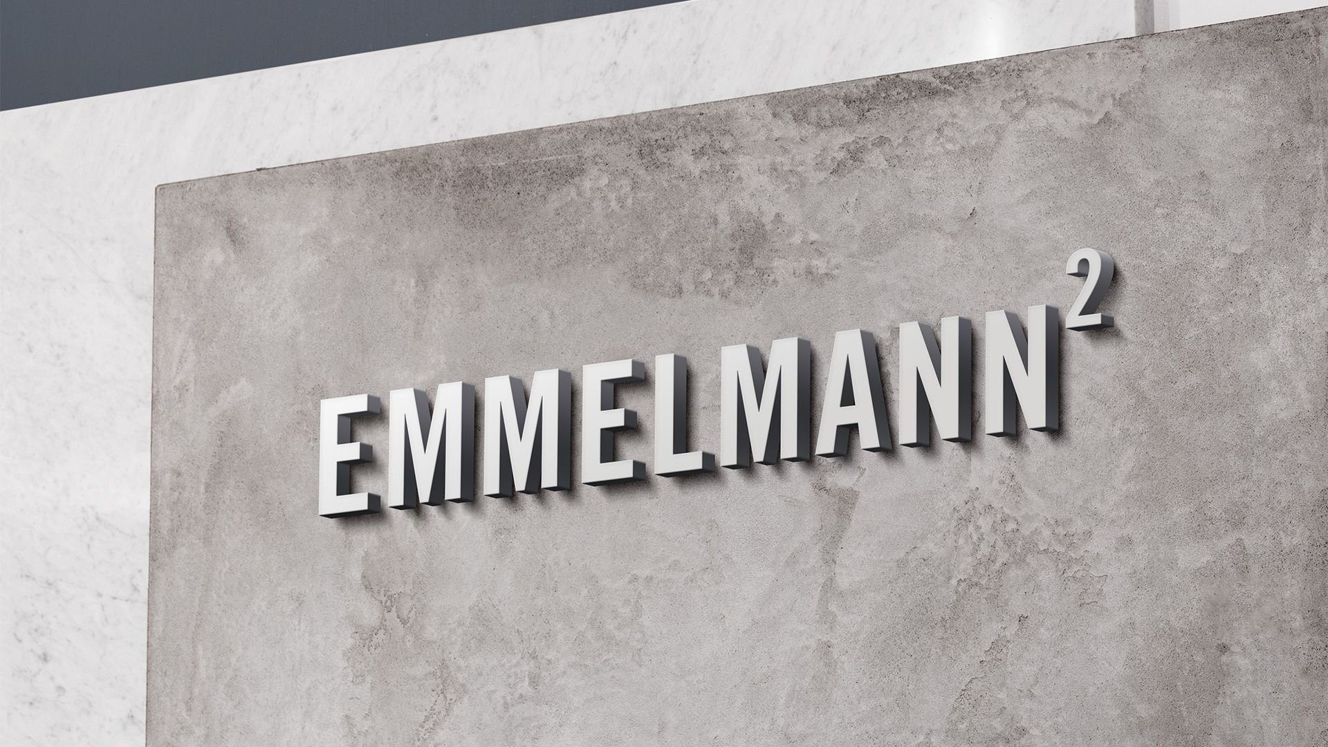Emmelmann Schriftzug als 3D-Buchstaben auf Betonwand
